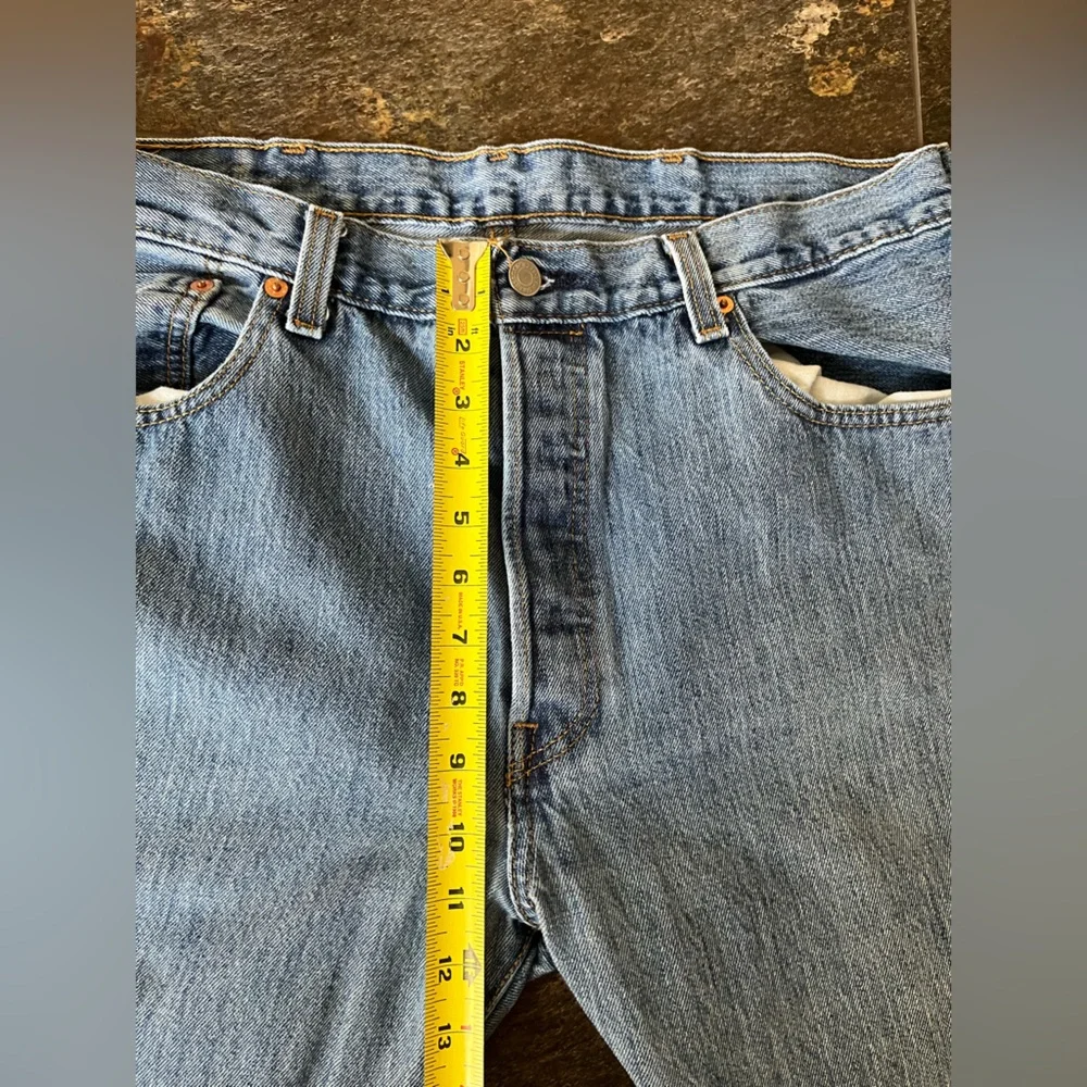 Men’s Levi’s 501 button fly medium dark wash denim jeans. Size 38x30.